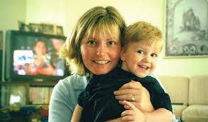 Debbie holding her young child